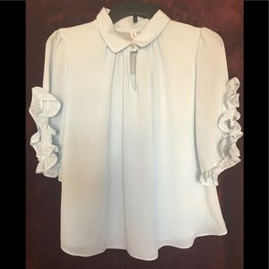 Airy, baby blue blouse offering tailored sleeves